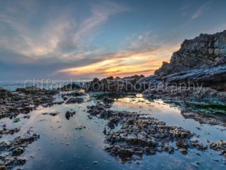 Rocky reflections with a cool sunset behind