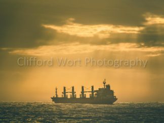 Ocean Coast line with a ship at sunset at Seapoint